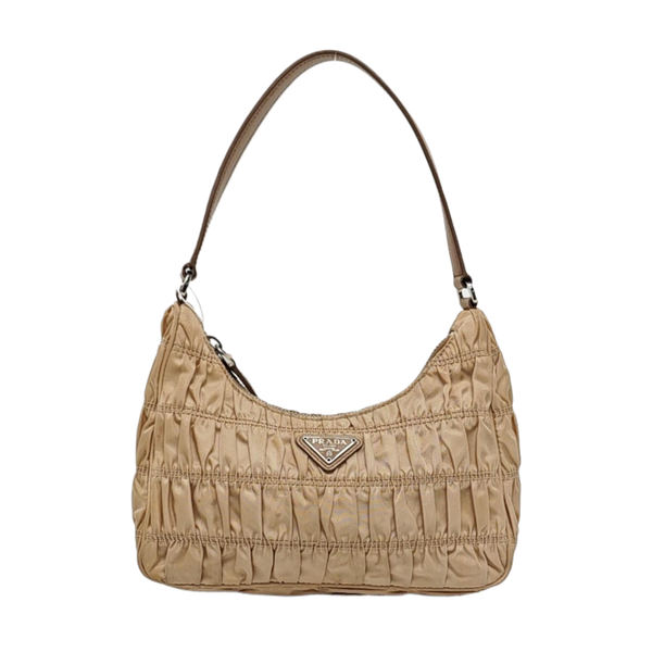 Authenticated pre-owned Re-Edition2005 Mini Quilted Nylon Beige - Top Handle Bag at Looply