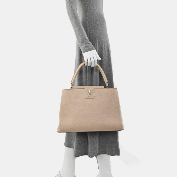 Authenticated pre-owned CAPUCINES GM Calfskin Pink - Top Handle Bag at Looply