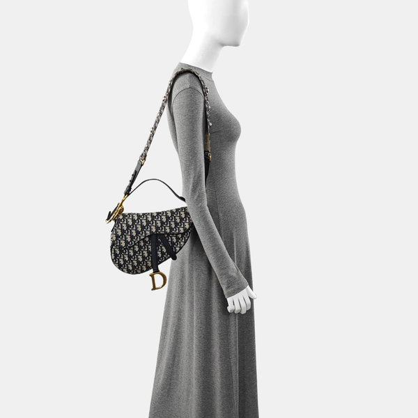 Authenticated pre-owned Saddle Medium Monogram Canvas Blue - Shoulder Bag at Looply