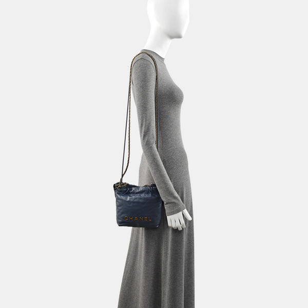 Authenticated pre-owned CHANEL 22 Mini Quilted Calfskin Blue - Bucket Bag at Looply