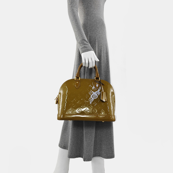 Authenticated pre-owned ALMA PM Patent Leather Yellow - Top Handle Bag at Looply