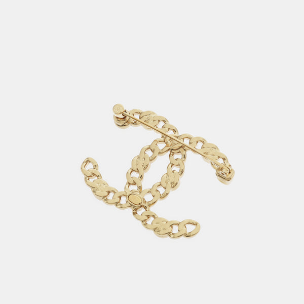 Broche de oro de metal