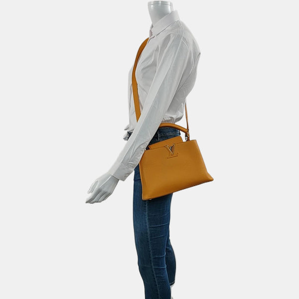Authenticated pre-owned CAPUCINES BB Calfskin Orange - Shoulder Bag at Looply