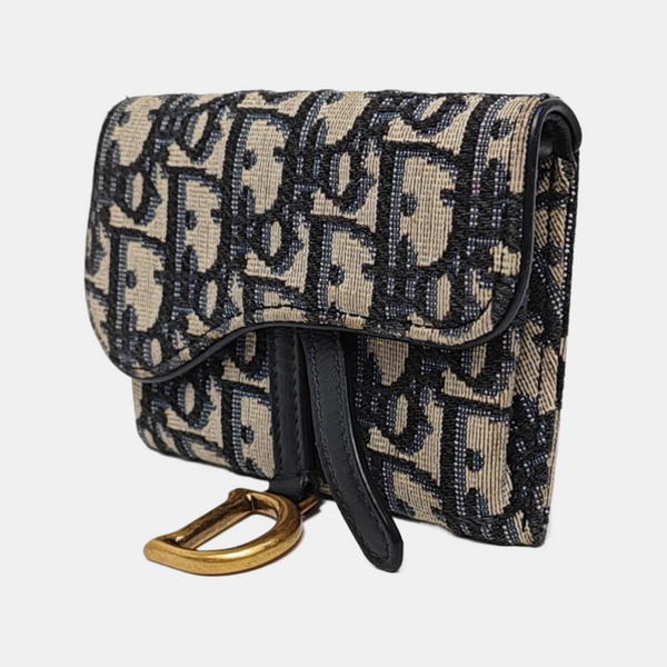 Authenticated pre-owned Saddle Oblique Canvas Blue - Clutch at Looply