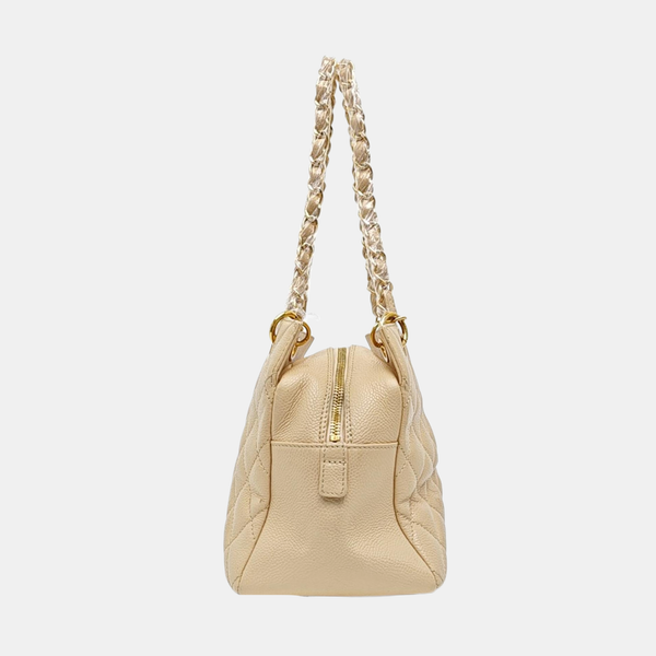 CHANEL PETITE Piel de becerro graneada acolchada beige