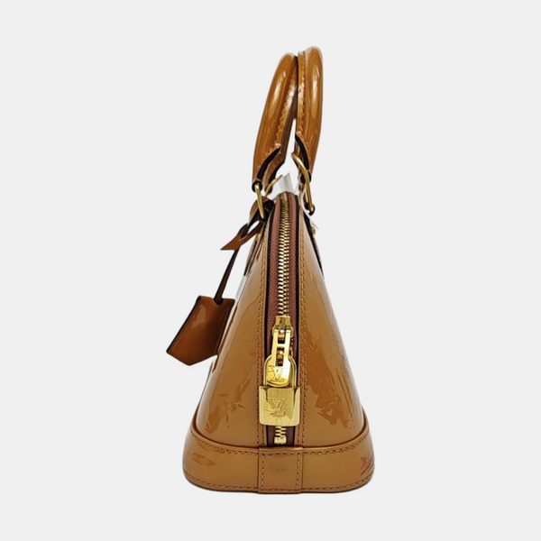 Authenticated pre-owned ALMA Monogram Patent Leather Yellow - Shoulder Bag at Looply