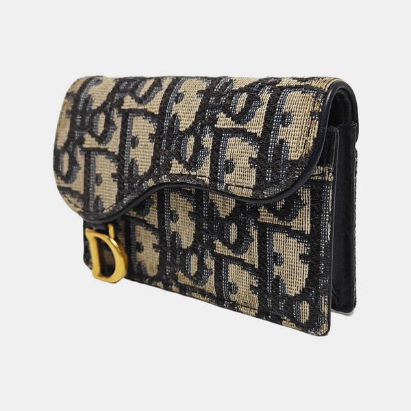 Authenticated pre-owned Saddle Monogram Fabric Blue Card Holder - Card Holder at Looply