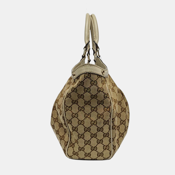 Authenticated pre-owned Sukey Monogram Canvas Beige - Top Handle Bag at Looply