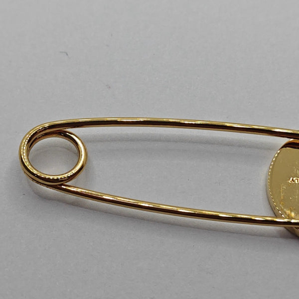 Broche de oro de metal