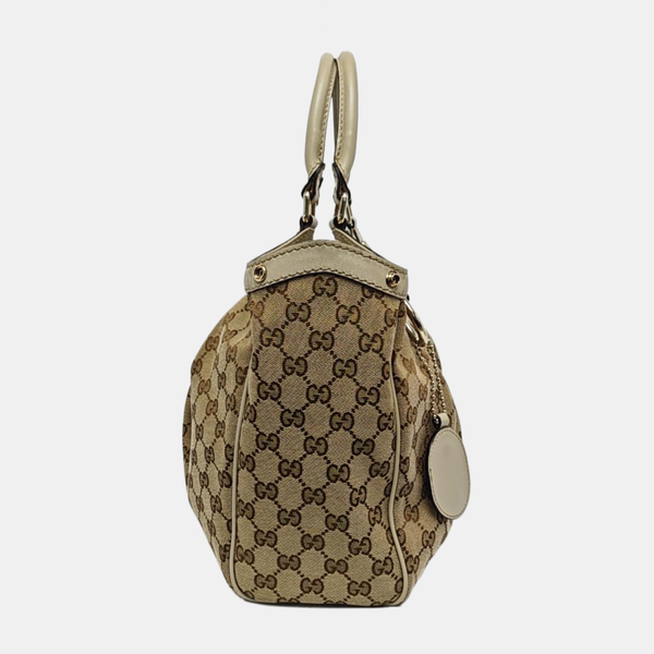Authenticated pre-owned Sukey Monogram Canvas Beige - Top Handle Bag at Looply