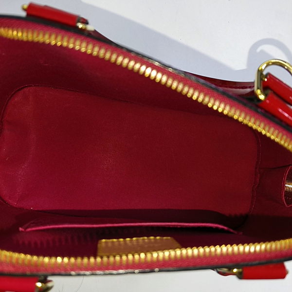 Authenticated pre-owned ALMA BB Monogram Patent Leather Red - Shoulder Bag at Looply
