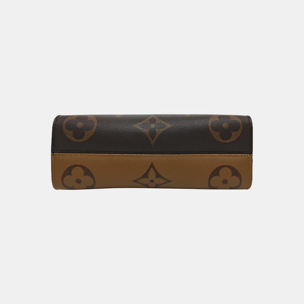 ONTHEGO EAST WEST PM Monogram Coated Canvas Brown