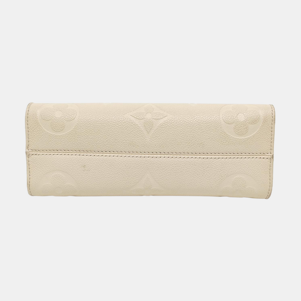 ONTHEGO EAST WEST Monogram Calfskin Beige