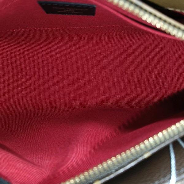 ONTHEGO EAST WEST PM Monogram Coated Canvas Brown