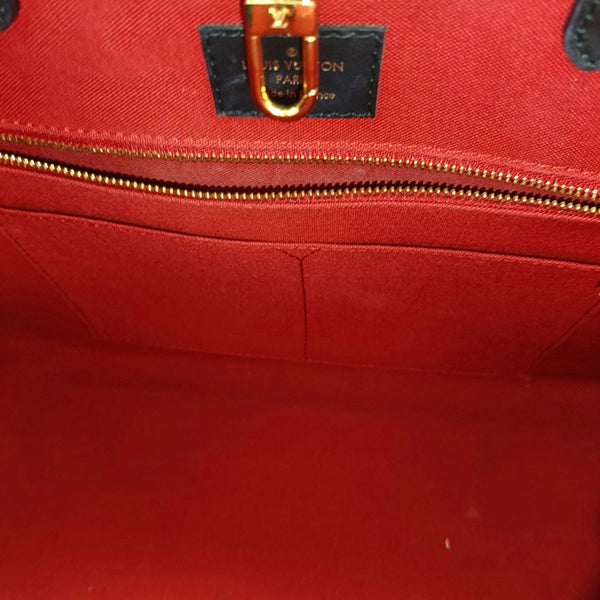 ONTHEGO MM Monogram Coated Canvas Brown