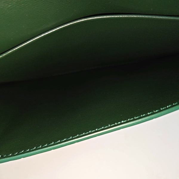 Authenticated pre-owned Hourglass Calfskin Green - Clutch at Looply
