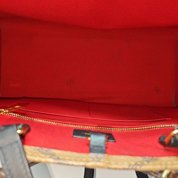 ONTHEGO MM Monogram Coated Canvas Brown