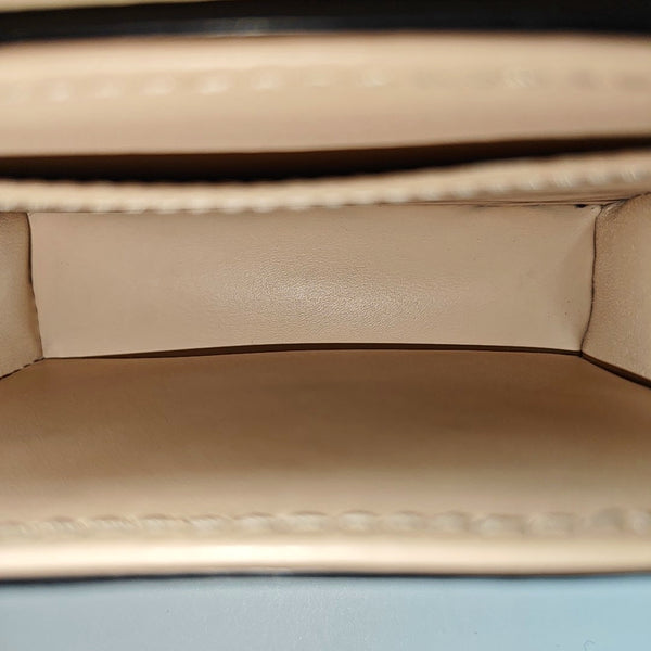 TRUNK Monogram Coated Canvas Brown