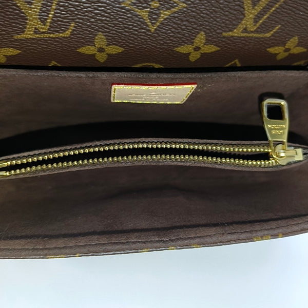 MÉTIS EAST WEST Monogram Coated Canvas Brown