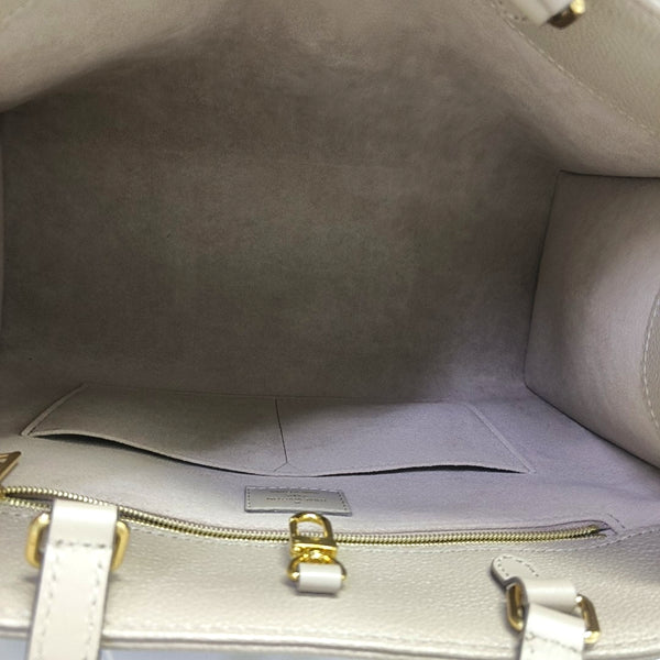 Authenticated pre-owned ONTHEGO MM Monogram Calfskin Grey - Tote Bag at Looply