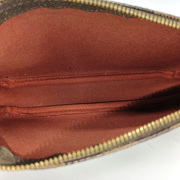 Authenticated pre-owned ACCESSOIRES MM Damier Ebene Coated Canvas Brown - Clutch at Looply