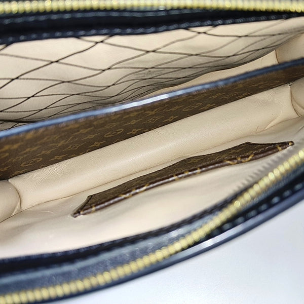 TRUNK Monogram Coated Canvas Brown
