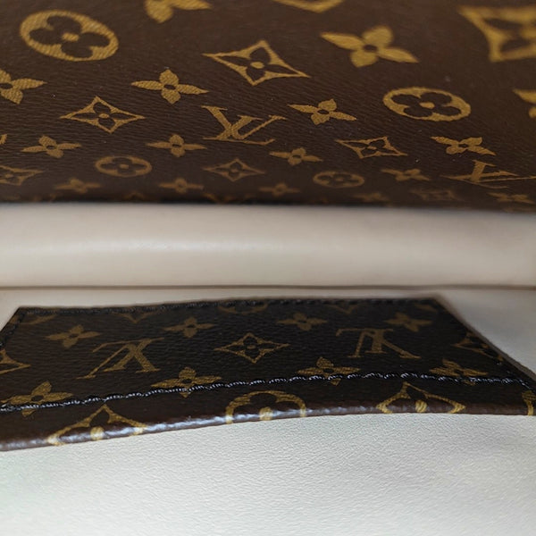TRUNK Monogram Coated Canvas Brown