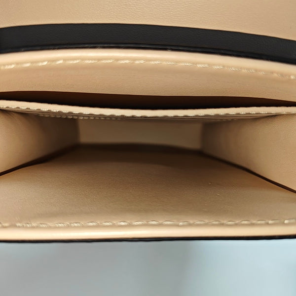 TRUNK Monogram Coated Canvas Brown