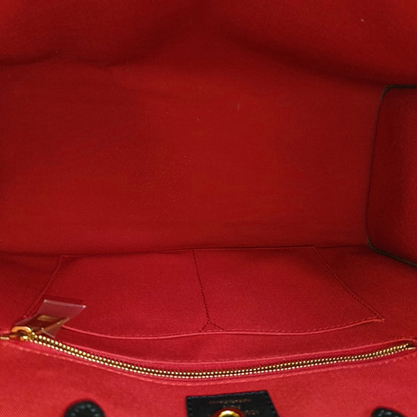 ONTHEGO MM Monogram Coated Canvas Brown