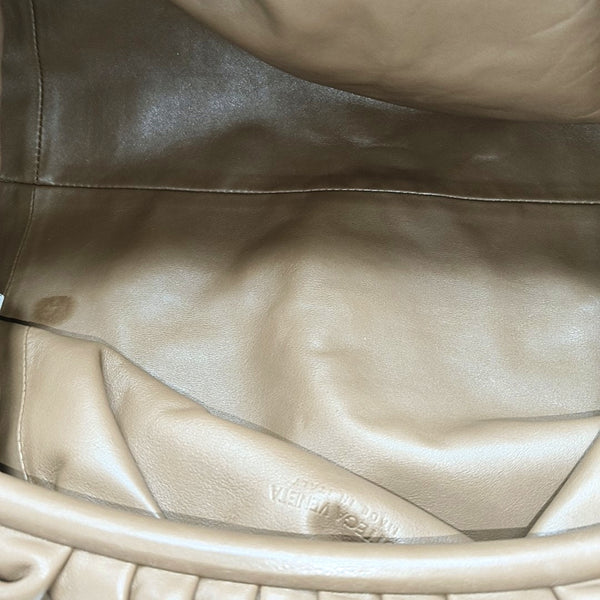 Authenticated pre-owned The Pouch Calfskin Brown - Clutch at Looply