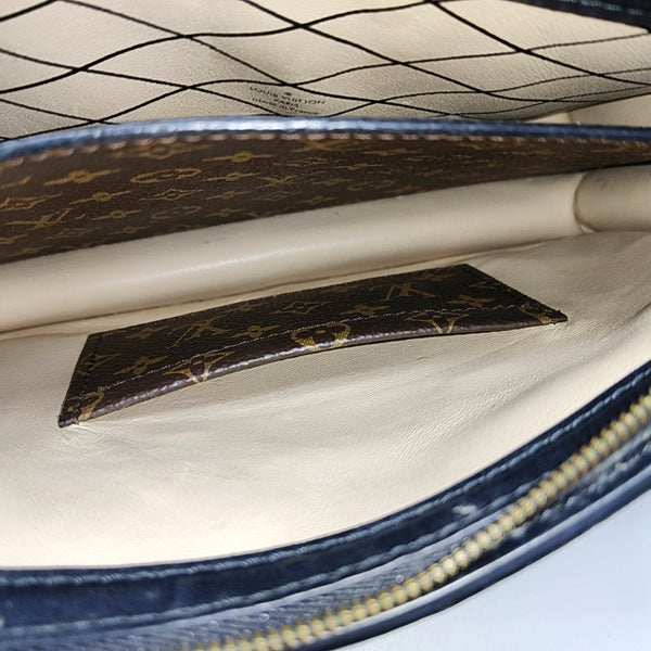 TRUNK Monogram Coated Canvas Brown