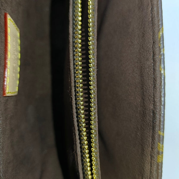MÉTIS EAST WEST Monogram Coated Canvas Brown