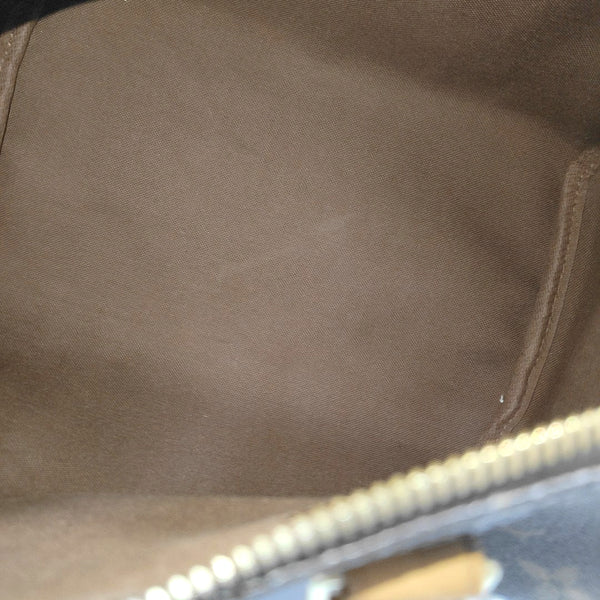 SPEEDY 25 Monogram Coated Canvas Brown