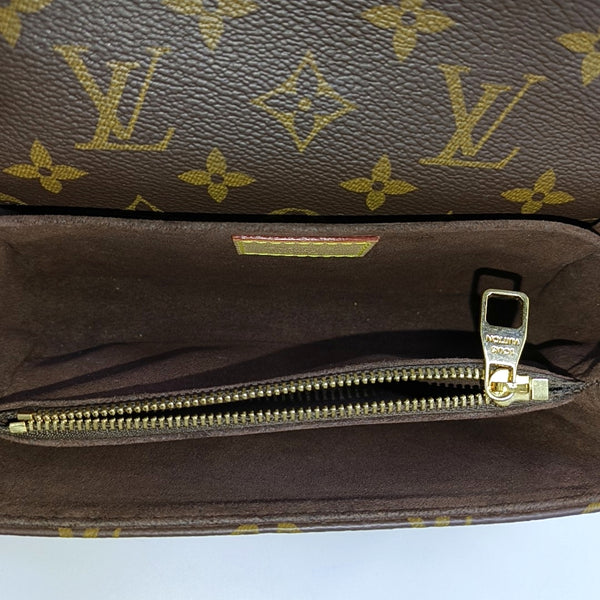 MÉTIS EAST WEST Monogram Coated Canvas Brown