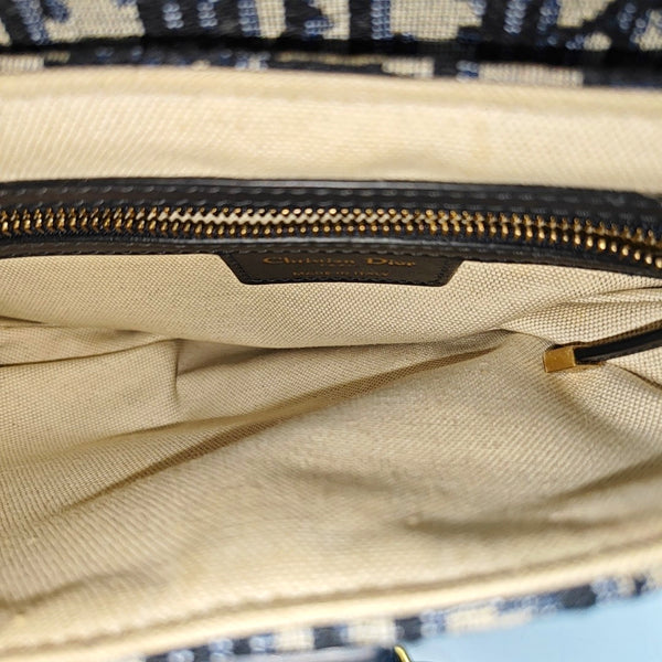 Authenticated pre-owned Saddle Medium Monogram Canvas Blue - Shoulder Bag at Looply