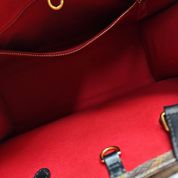 ONTHEGO MM Monogram Coated Canvas Brown