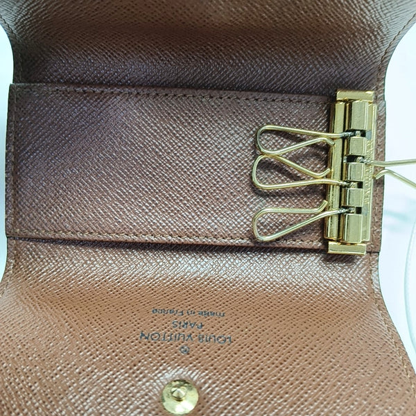 Monogram Coated Canvas Clutch Brown