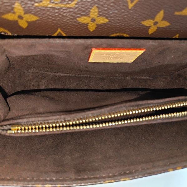 MÉTIS EAST WEST Monogram Coated Canvas Brown