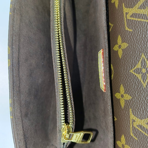 MÉTIS EAST WEST Monogram Coated Canvas Brown