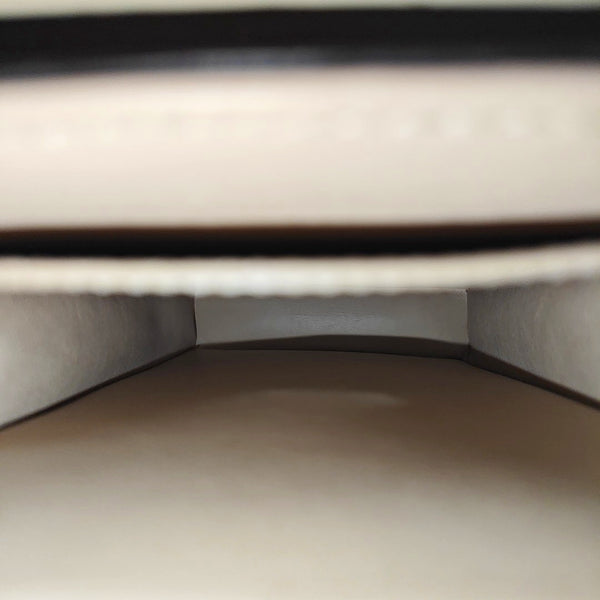 TRUNK Monogram Coated Canvas Brown