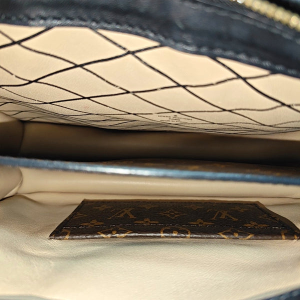 TRUNK Monogram Coated Canvas Brown