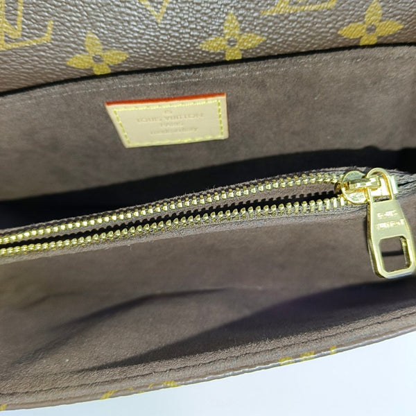 MÉTIS EAST WEST Monogram Coated Canvas Brown