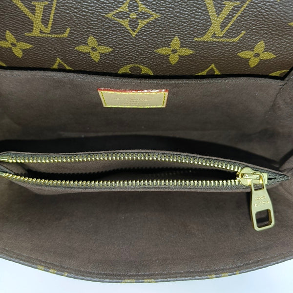MÉTIS EAST WEST Monogram Coated Canvas Brown