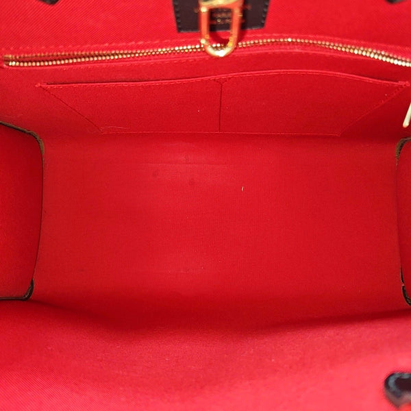 ONTHEGO MM Monogram Coated Canvas Brown