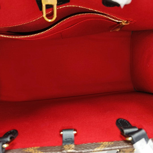 ONTHEGO MM Monogram Coated Canvas Brown