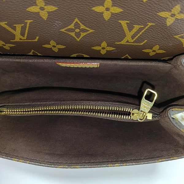 MÉTIS EAST WEST Monogram Coated Canvas Brown