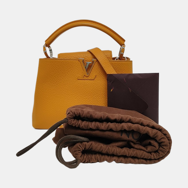 Authenticated pre-owned CAPUCINES BB Calfskin Orange - Shoulder Bag at Looply