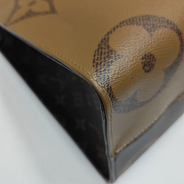 ONTHEGO MM Monogram Coated Canvas Brown