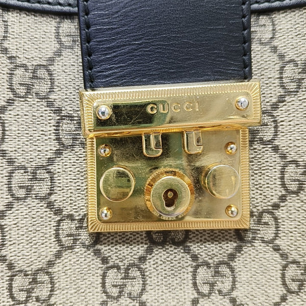 Padlock Small Monogram Coated Canvas Beige
