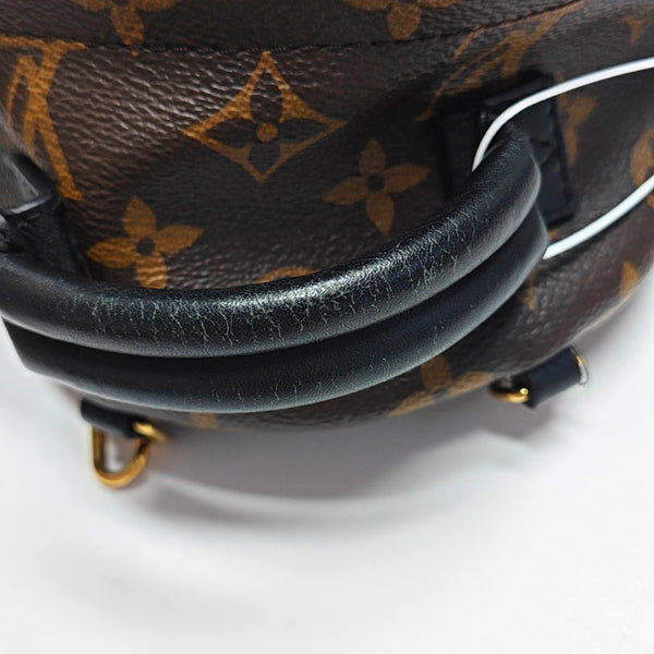 Authenticated pre-owned PALM SPRINGS Mini Monogram Coated Canvas Brown - Backpack at Looply